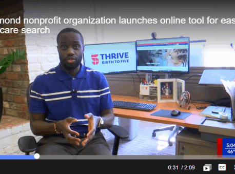 Jamal Williams sits at a desk with two monitors and shows the Thrive Birth to Five Child Care Finder tool.